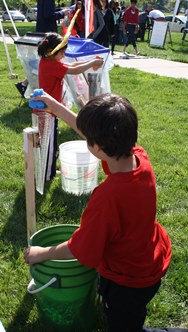 Kids race to fill the rain gauge