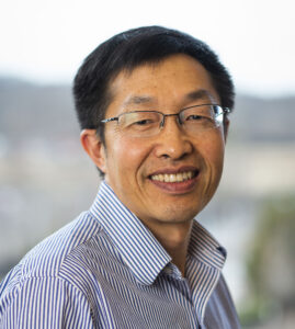 Dr. Liang smiles at the camera