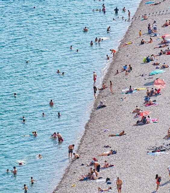 A crowded beach on a hot day