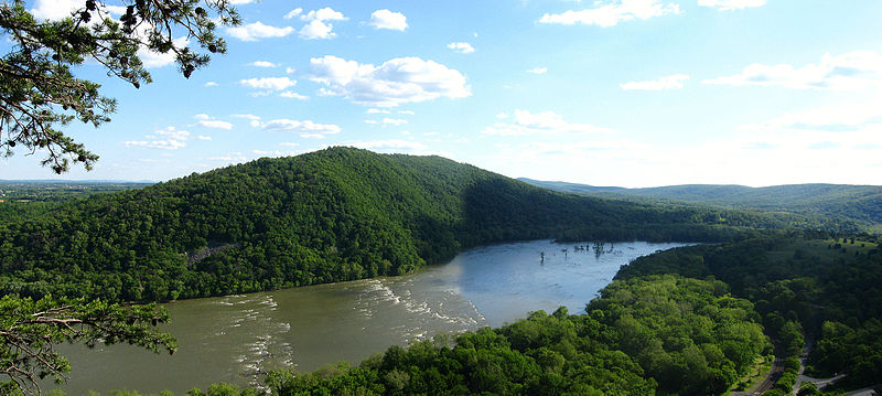 The Potomac River winds through dense green forests