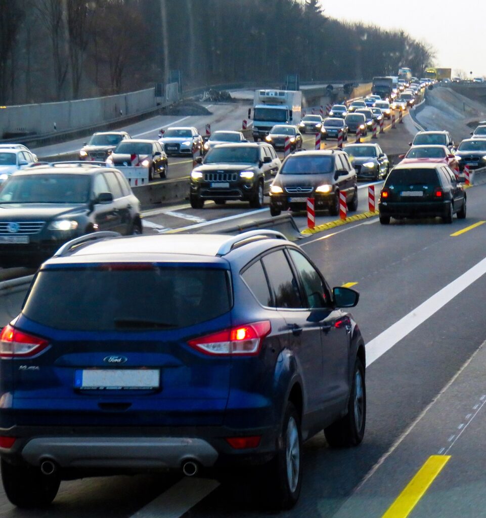 Many cars on a highway are stuck in a traffic jam