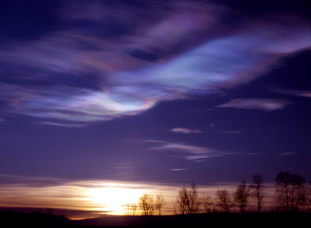 Stratospheric clouds above the Arctic, like those seen here over Kiruna, Sweden, provide ideal conditions for chemical reactions that transform chlorine to a form that depletes the Earth’s protective ozone layer. New research shows that unless greenhouse gas emissions are reduced, climate patterns that favor the formation of such clouds will continue to accelerate ozone loss. (Photo Credit: Ross Salawitch/UMD).