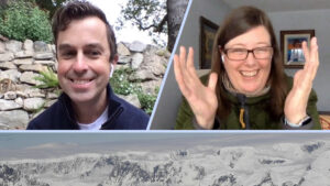 Kelly Brunt and Alex Gardner smile and wave at the camera, overtop a background of Antarctica