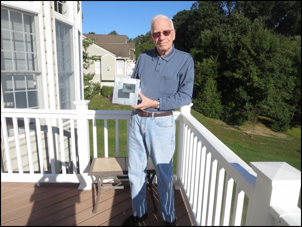 Norm Grody poses with a homemade microwave radiometer